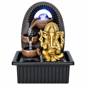 Miniature three-tier water fountain with a glowing purple orb on top and a golden Ganesha figurine beside it